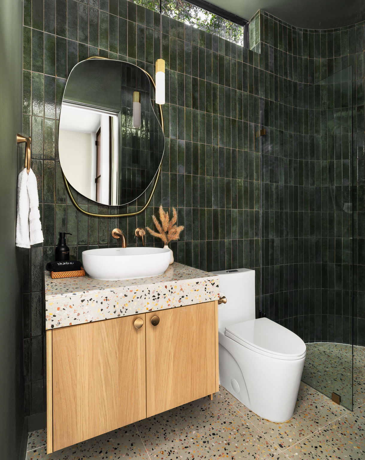 Undisclosed Address Austin, TX 78702 - Photo 17 of 38 Bathroom with vanity, tile walls, tiled shower, and tasteful backsplash