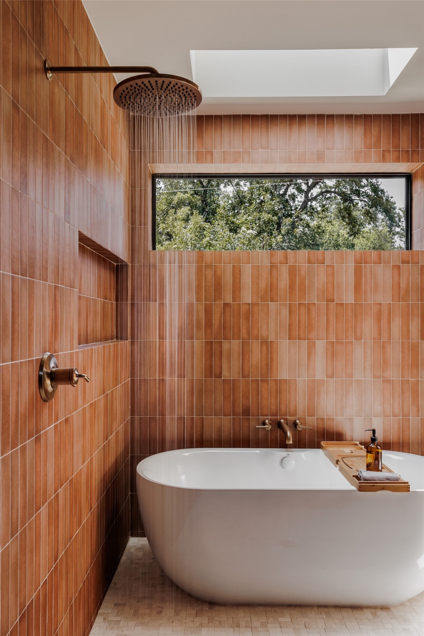 Undisclosed Address Austin, TX 78702 - Photo 23 of 38 Bathroom with a soaking tub, tile walls, and a skylight