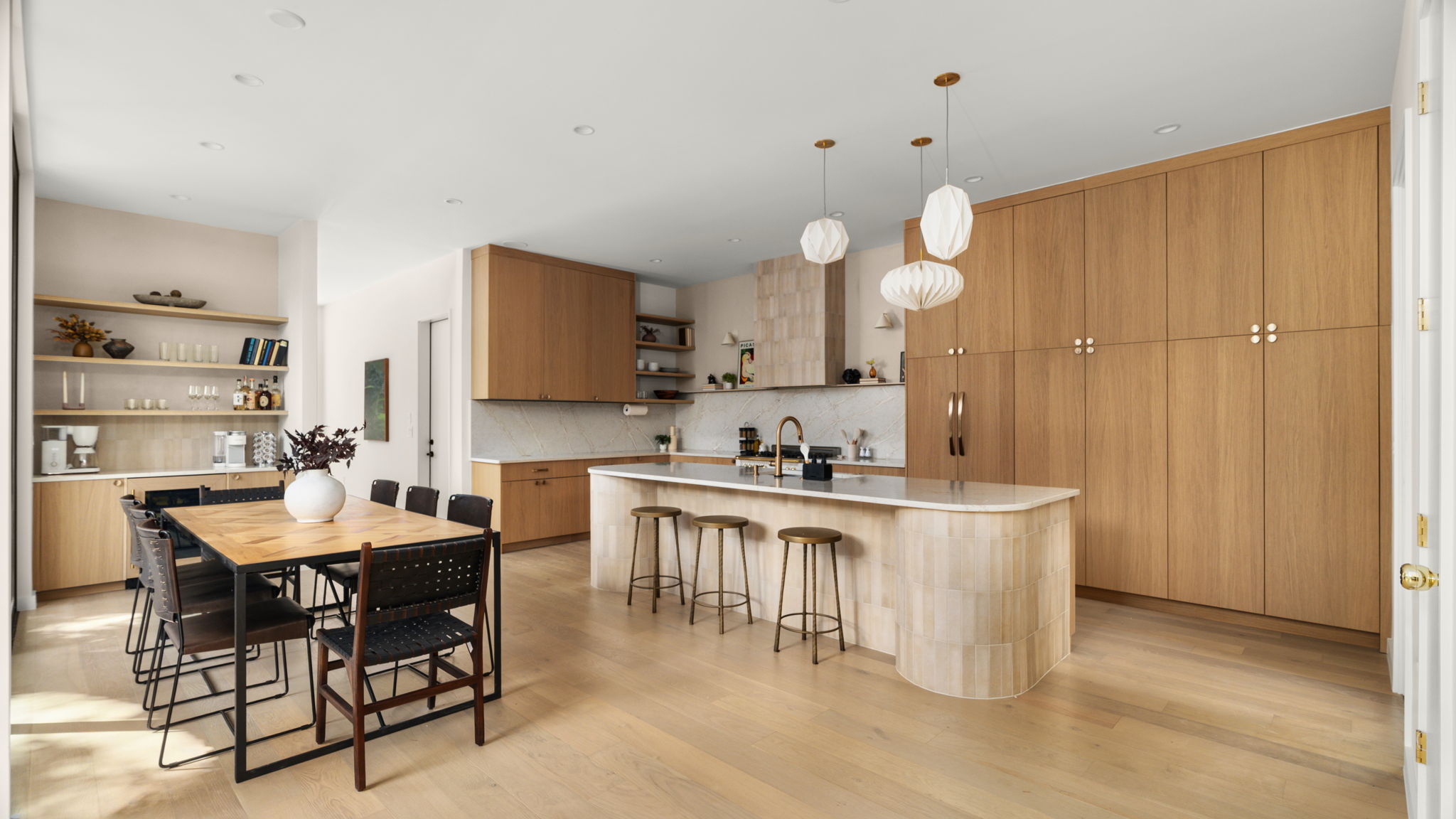 Undisclosed Address Austin, TX 78702 - Photo 5 of 38 Kitchen with open shelves, modern cabinets, pendant lighting, and a kitchen bar