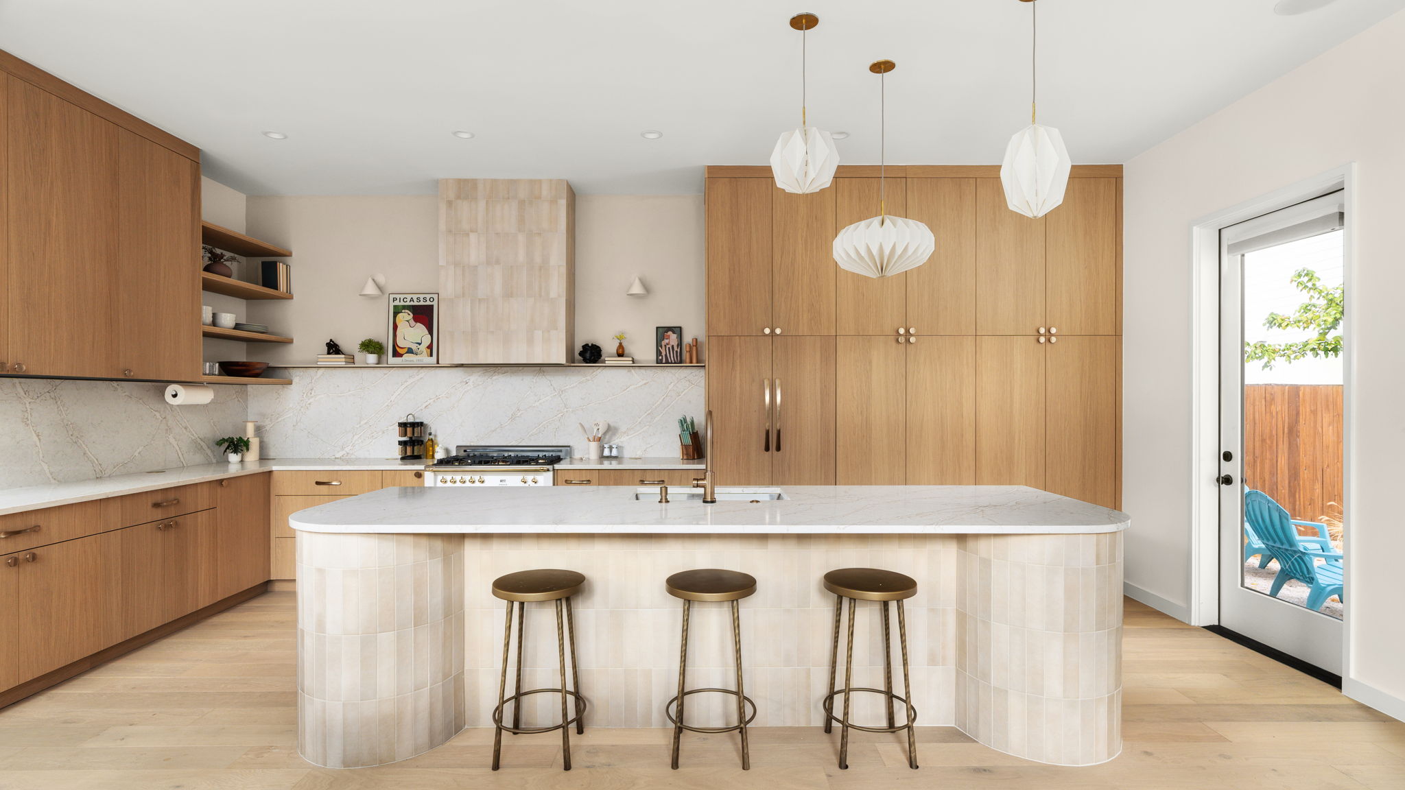 Undisclosed Address Austin, TX 78702 - Photo 8 of 38 Kitchen with a breakfast bar area, open shelves, light wood-type flooring, and decorative light fixtures