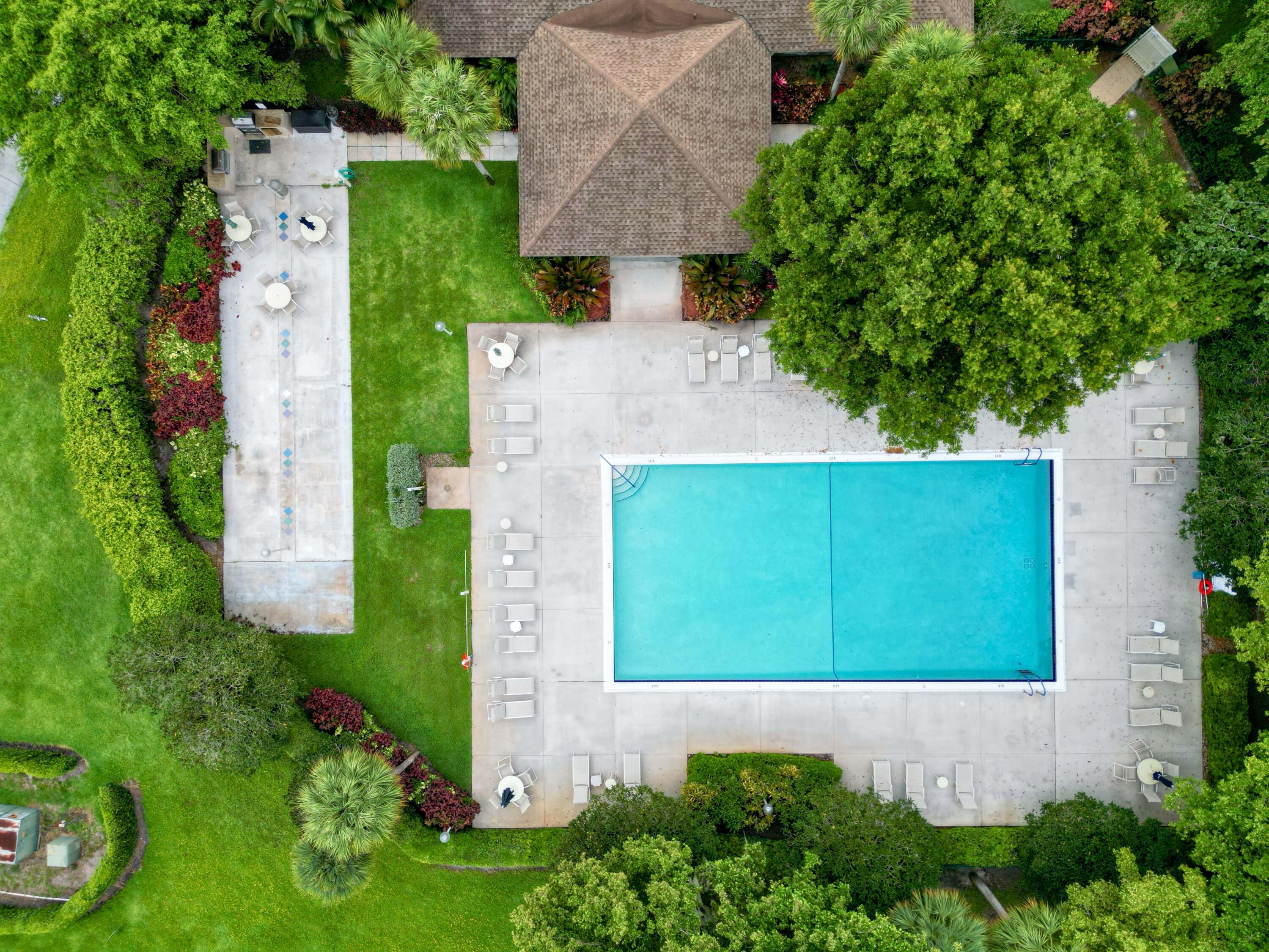 4030 West Palm Aire Drive, Unit 506 Pompano Beach, FL 33069 - Photo 14 of 14 an aerial view of a house with a yard and garden