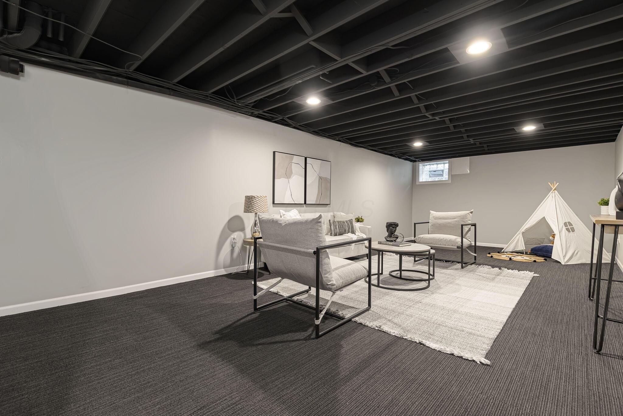 7140 Cook Road Powell, OH 43065 - Photo 76 of 87 Recessed lighting with a painted exposed ceiling, light gray walls, and dark gray carpet flooring