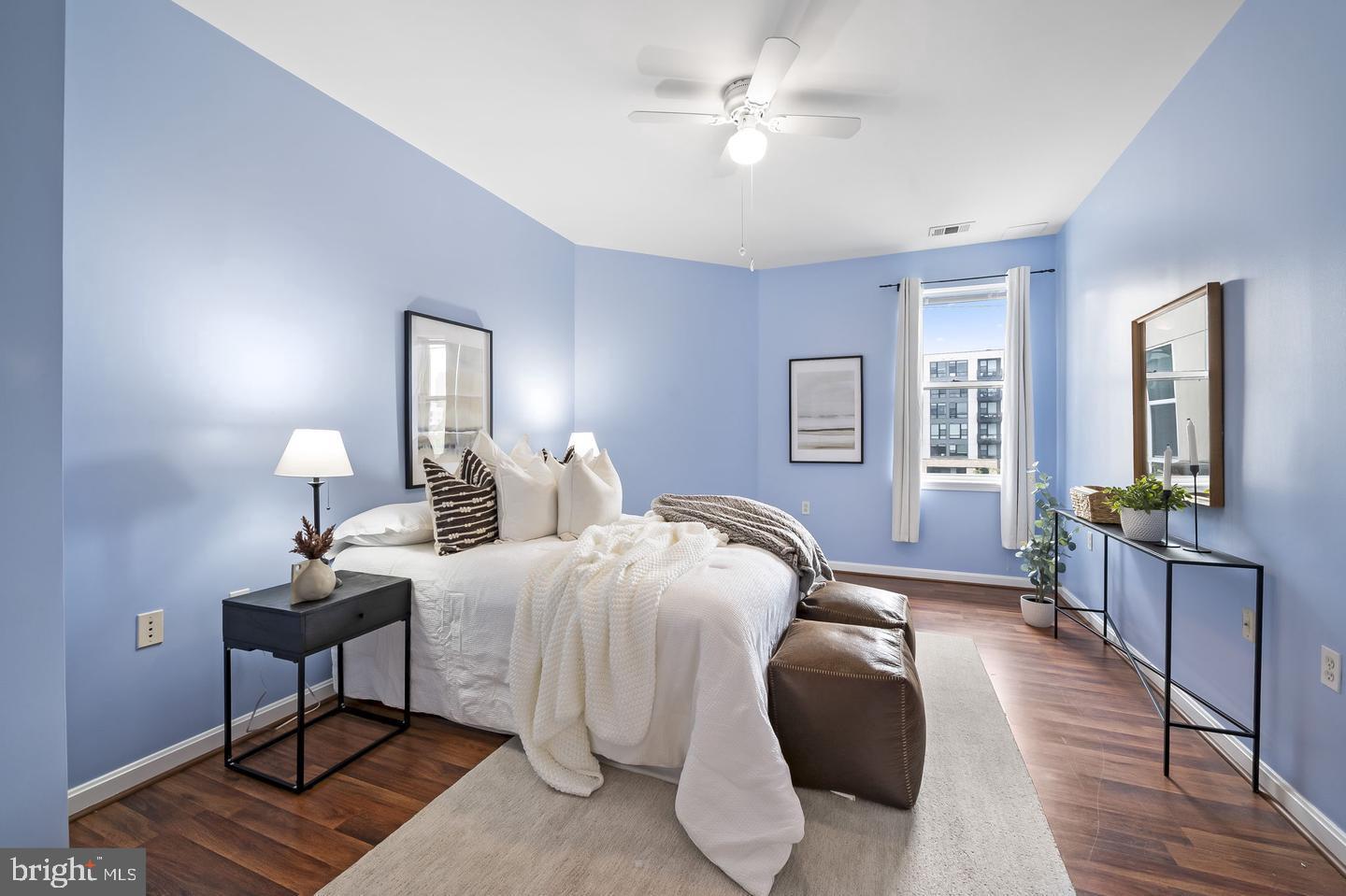 23 Pierside Drive, Unit 413 Baltimore, MD 21230 - Photo 14 of 36 a bedroom with bed and a chandelier