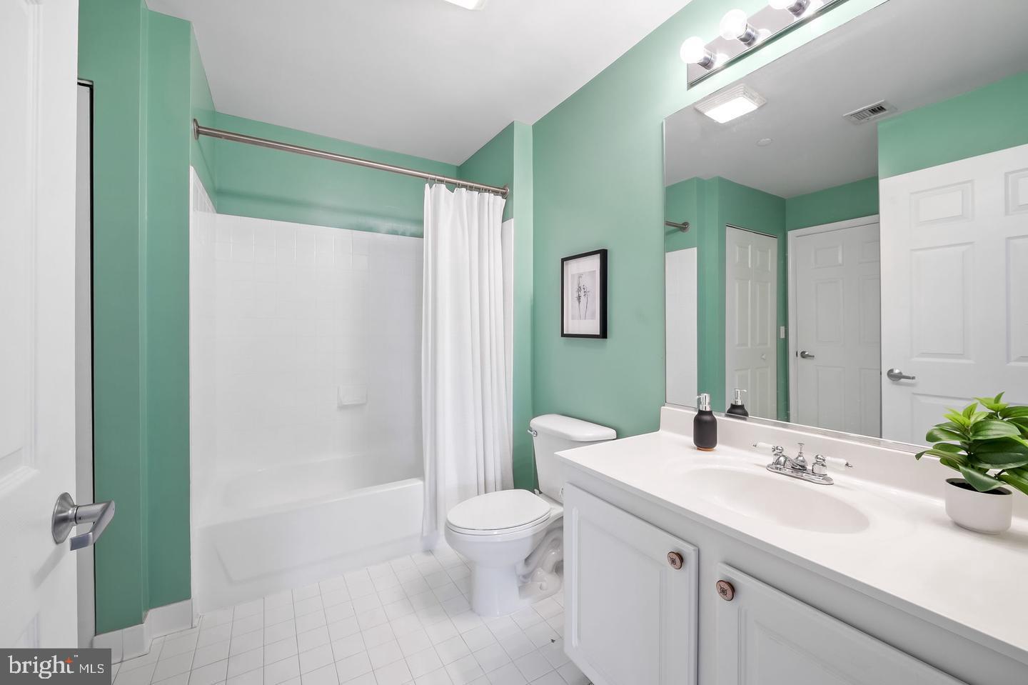 23 Pierside Drive, Unit 413 Baltimore, MD 21230 - Photo 20 of 36 a bathroom with a sink a toilet and shower