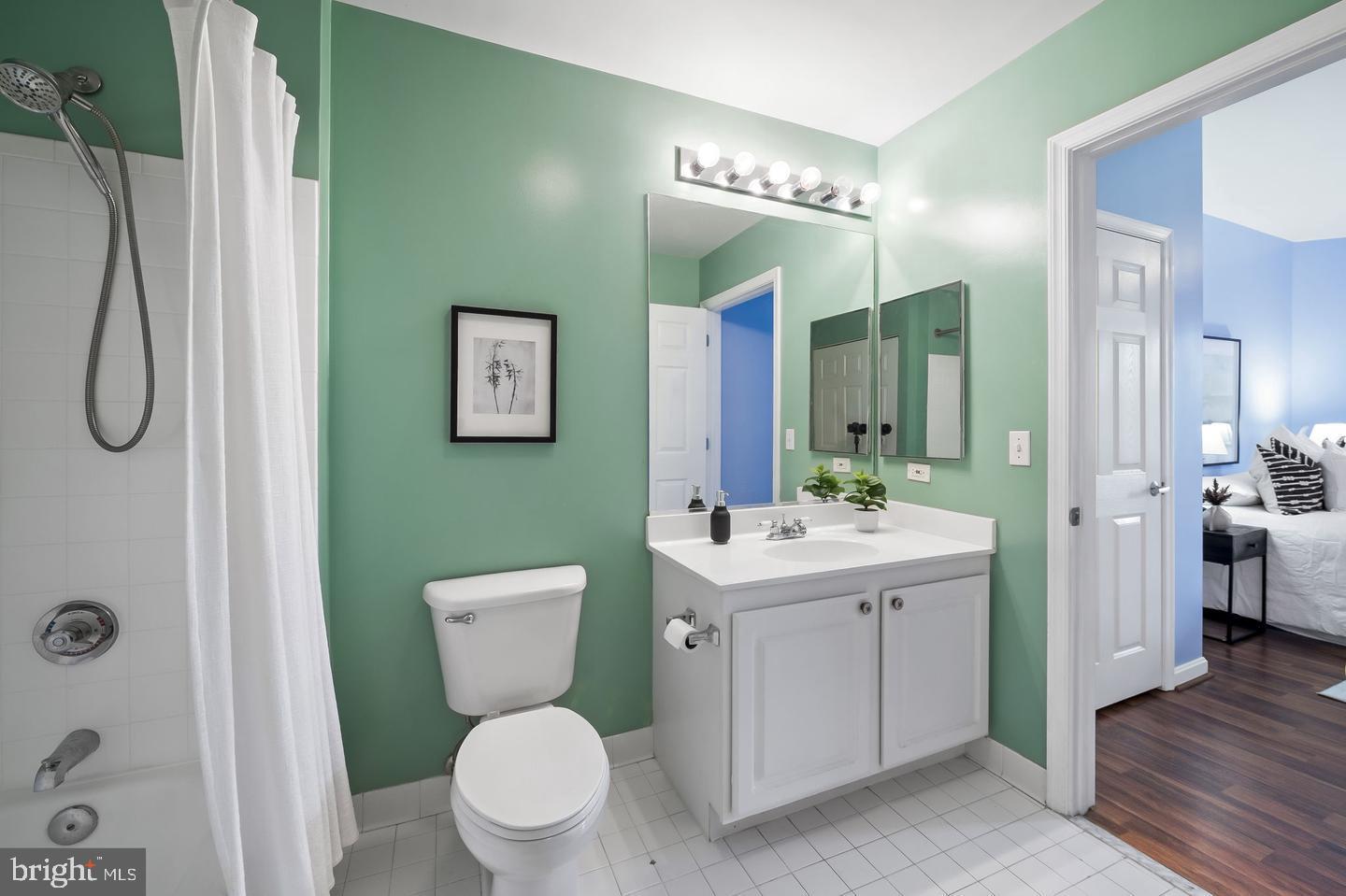 23 Pierside Drive, Unit 413 Baltimore, MD 21230 - Photo 21 of 36 a view of bathroom with a toilet sink and mirror