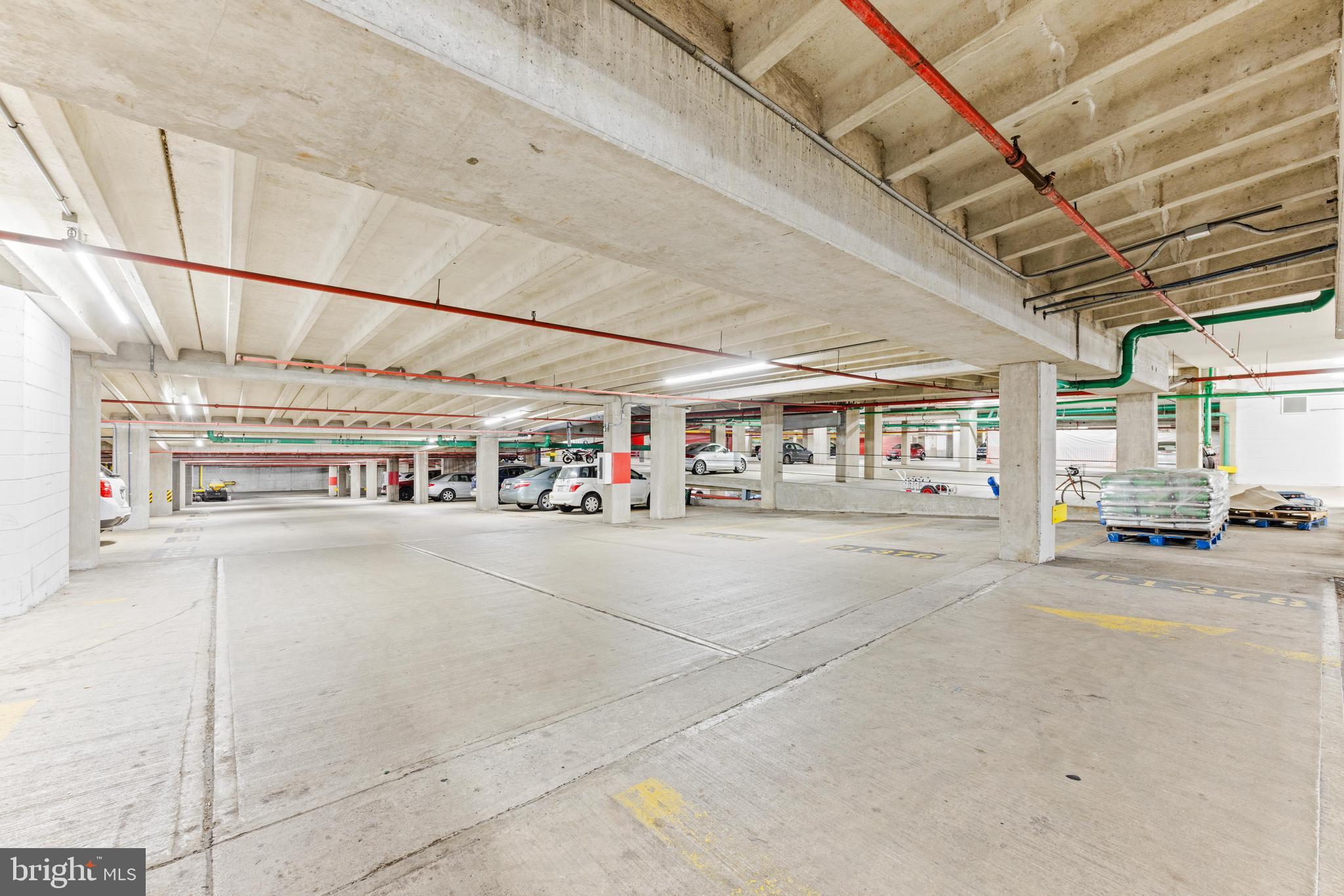 23 Pierside Drive, Unit 413 Baltimore, MD 21230 - Photo 31 of 36 a living room with lots of furniture and a chandelier