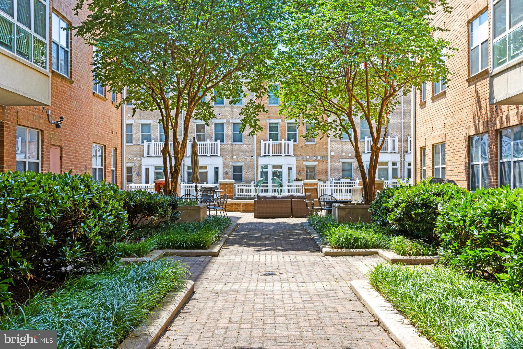 23 Pierside Drive, Unit 413 Baltimore, MD 21230 - Photo 35 of 36 a front view of a building with garden