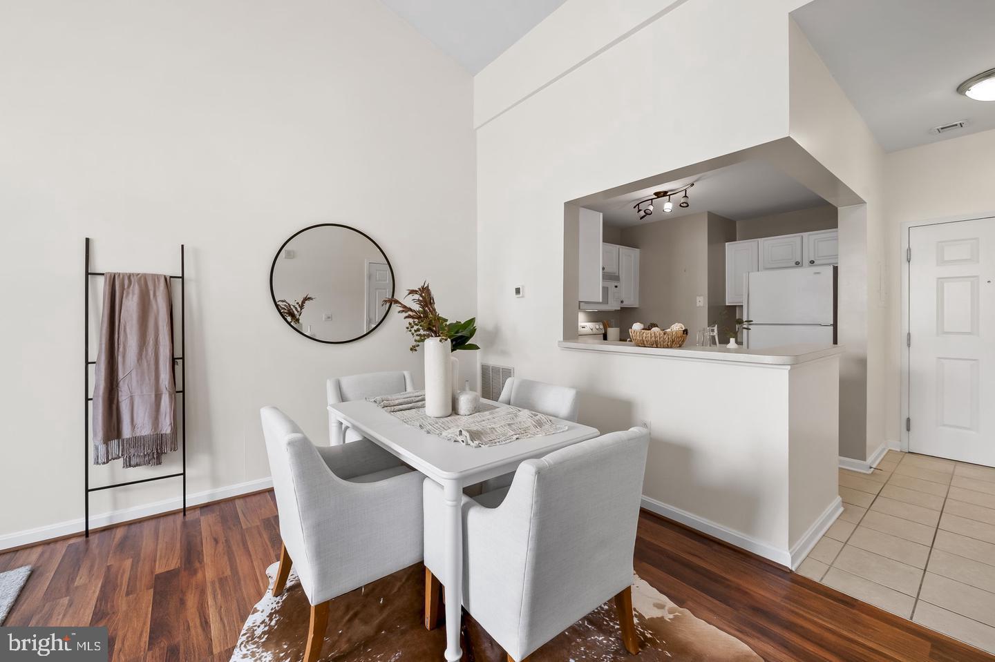 23 Pierside Drive, Unit 413 Baltimore, MD 21230 - Photo 8 of 36 a view of a dining room with furniture and wooden floor