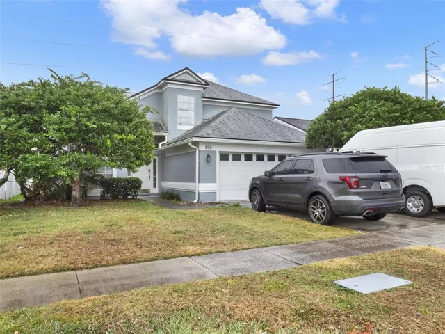 a view of a car parked in front of a house