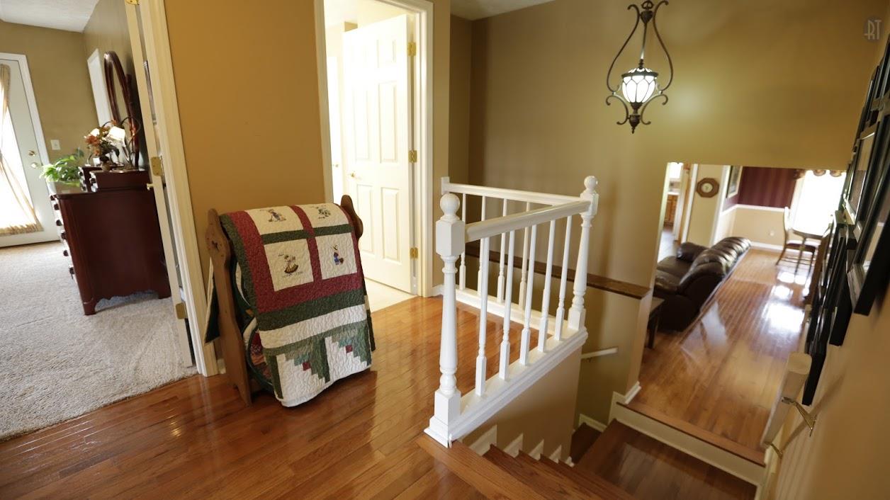 402 Ranch Road Portland, TN 37148 - Photo 15 of 24 a view of a hallway with wooden floor and stairs