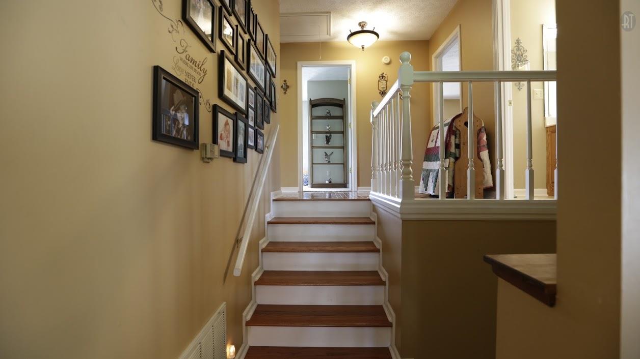 402 Ranch Road Portland, TN 37148 - Photo 16 of 24 a view of staircase with lots of frames on wall and a window