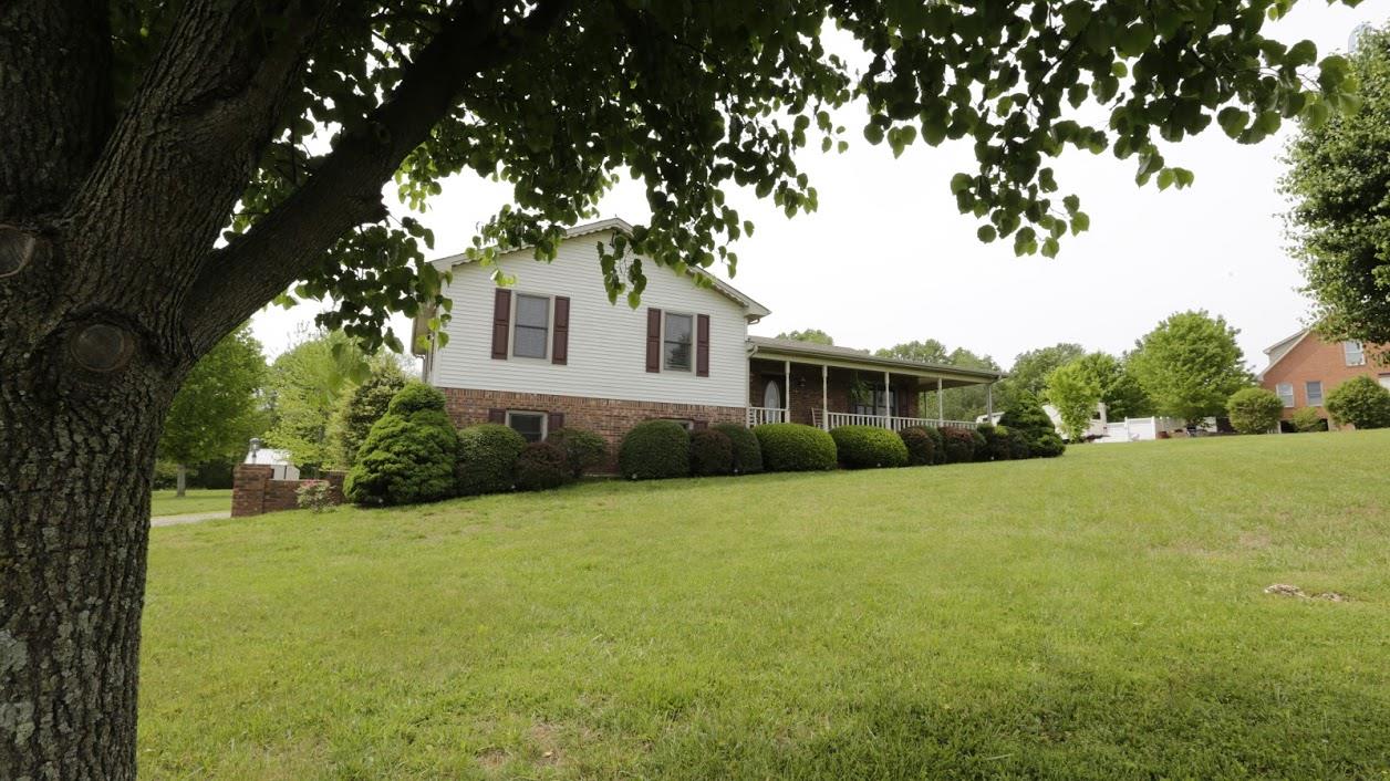 402 Ranch Road Portland, TN 37148 - Photo 2 of 24 a front view of a house with yard and green space