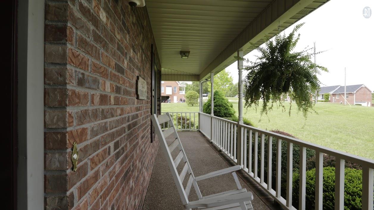 402 Ranch Road Portland, TN 37148 - Photo 4 of 24 a view of a balcony with wooden floor