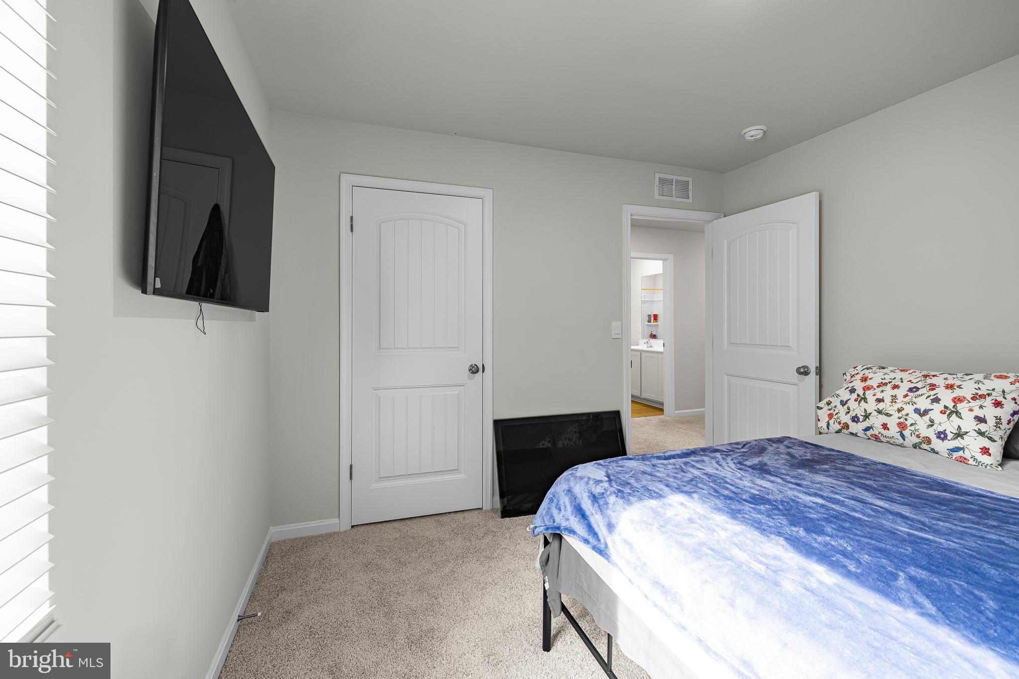 459 Currant Circle Magnolia, DE 19962 - Photo 26 of 39 a bedroom with a bed and a television