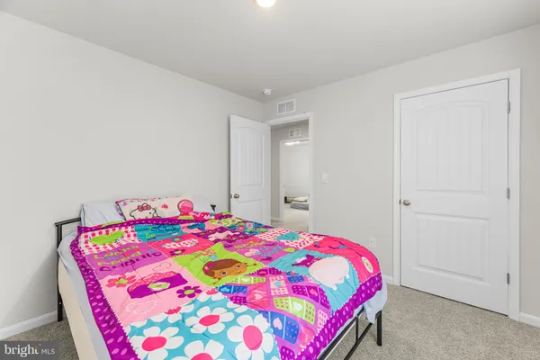 a bedroom with a bed and a table