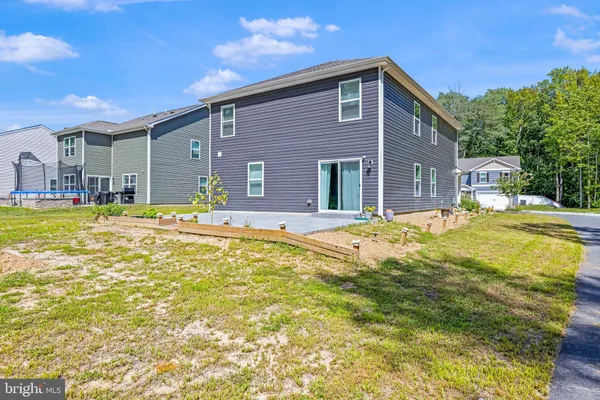 a swimming pool with outdoor seating and yard