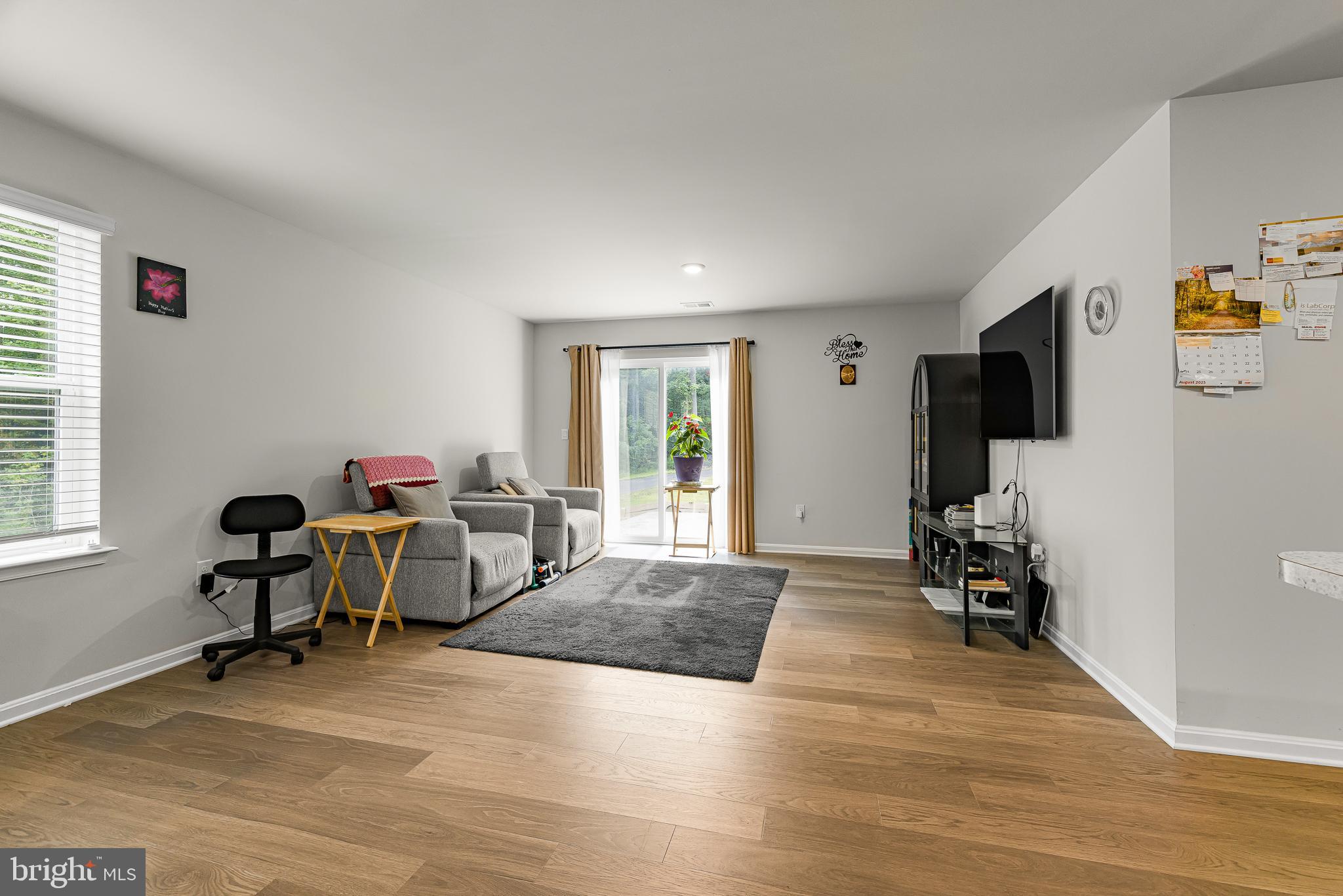 459 Currant Circle Magnolia, DE 19962 - Photo 6 of 39 a living room with furniture and a flat screen tv