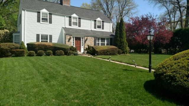 45 Bettswood Road Norwalk, CT 06851 - Photo 1 of 1 a front view of a house with garden and trees