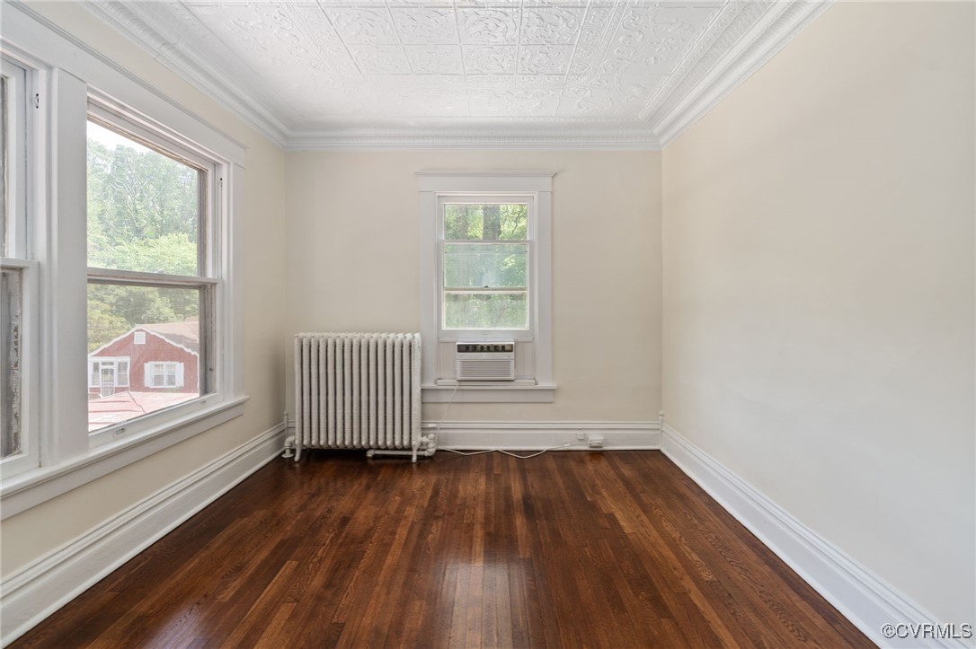 2707 Sherbourne Road Richmond, VA 23237 - Photo 26 of 50 Bedroom featuring radiator, wood flooring, an orna