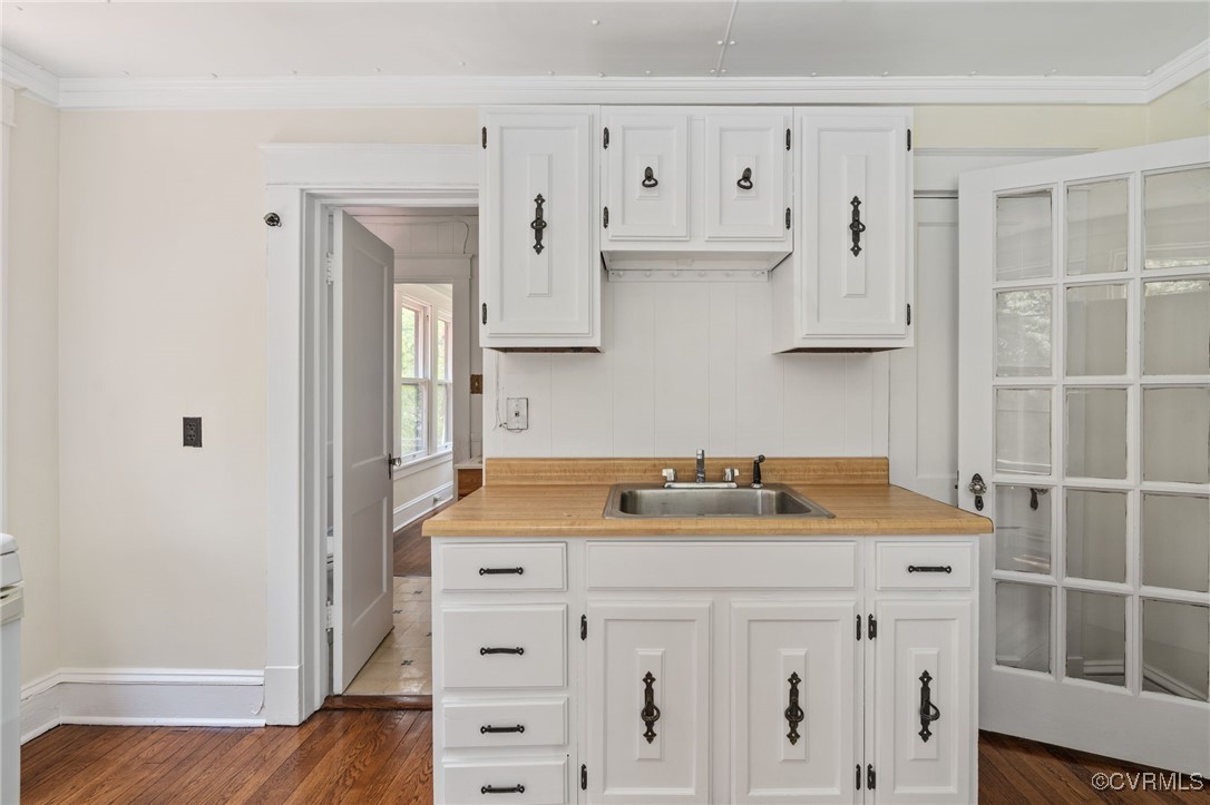 2707 Sherbourne Road Richmond, VA 23237 - Photo 40 of 50 Kitchen with a sink, white cabinets, light counter