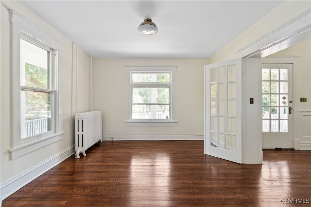 2707 Sherbourne Road Richmond, VA 23237 - Photo 7 of 50 Spare room featuring radiator, wood finished floor