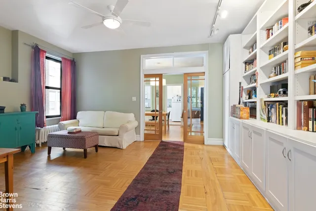 a living room with furniture and a rug