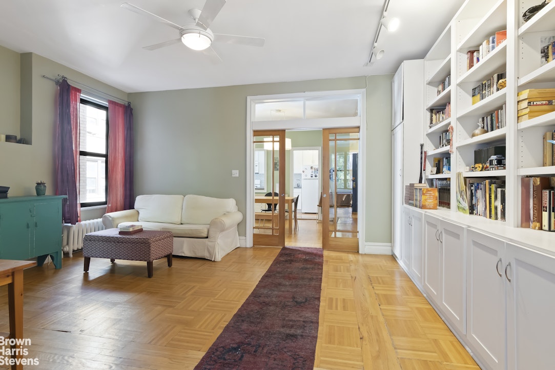 a living room with furniture and a rug