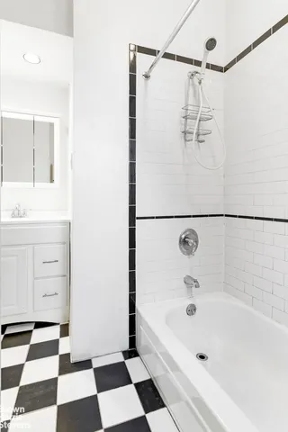 an empty room with closet and wooden floor