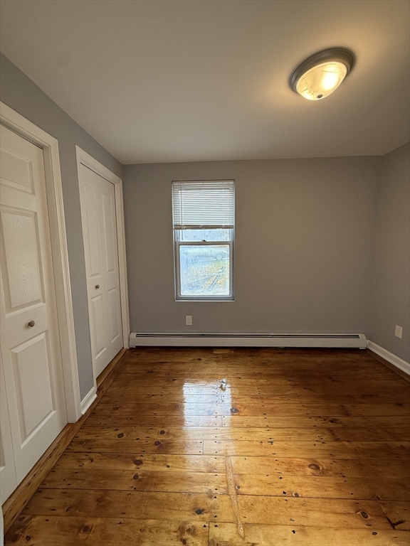 69 Hollis Street, Unit 13 Worcester, MA 01610 - Photo 3 of 8 a view of an empty room and window