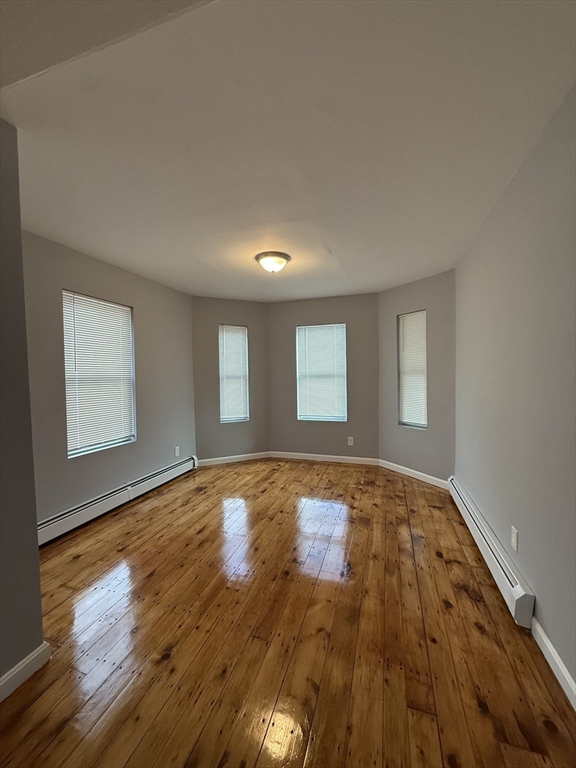 69 Hollis Street, Unit 13 Worcester, MA 01610 - Photo 7 of 8 a view of an empty room and window