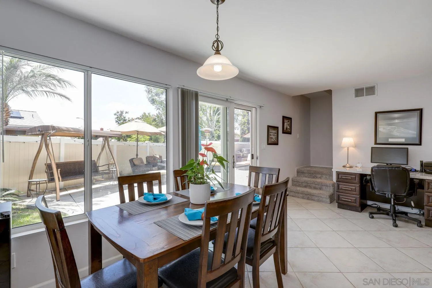 8531 Menkar Road San Diego, CA 92126 - Photo 11 of 37 a view of a dining room with furniture window and outside view