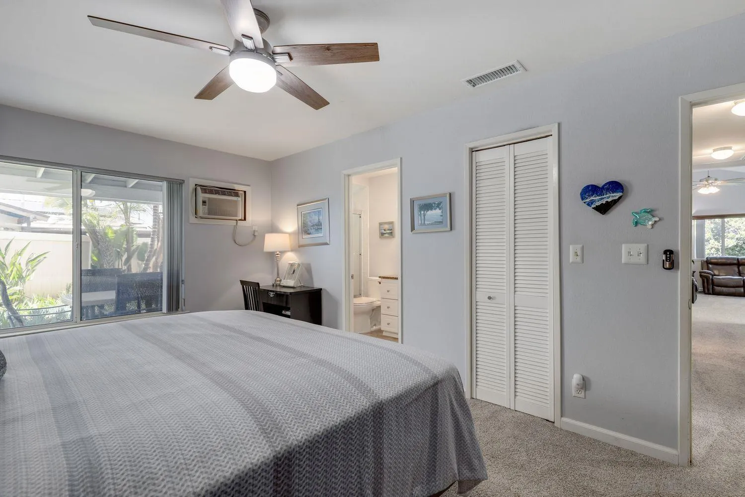 8531 Menkar Road San Diego, CA 92126 - Photo 14 of 37 a bedroom with a bed and a chandelier