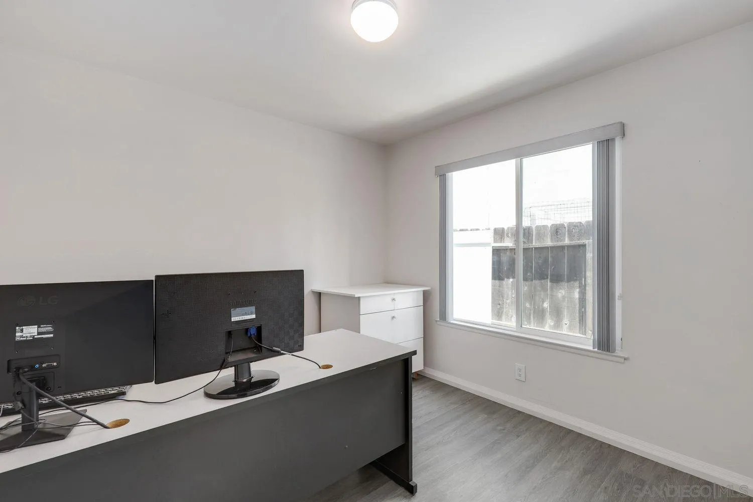 8531 Menkar Road San Diego, CA 92126 - Photo 16 of 37 a workspace with furniture and window
