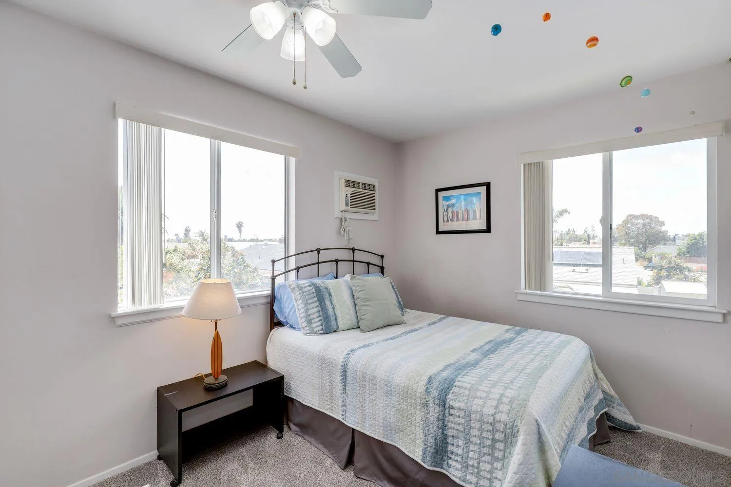 8531 Menkar Road San Diego, CA 92126 - Photo 21 of 37 a bedroom with a bed and a window