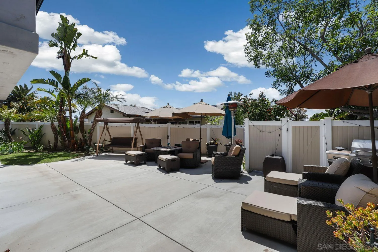 8531 Menkar Road San Diego, CA 92126 - Photo 24 of 37 a view of a patio with couches and potted plants