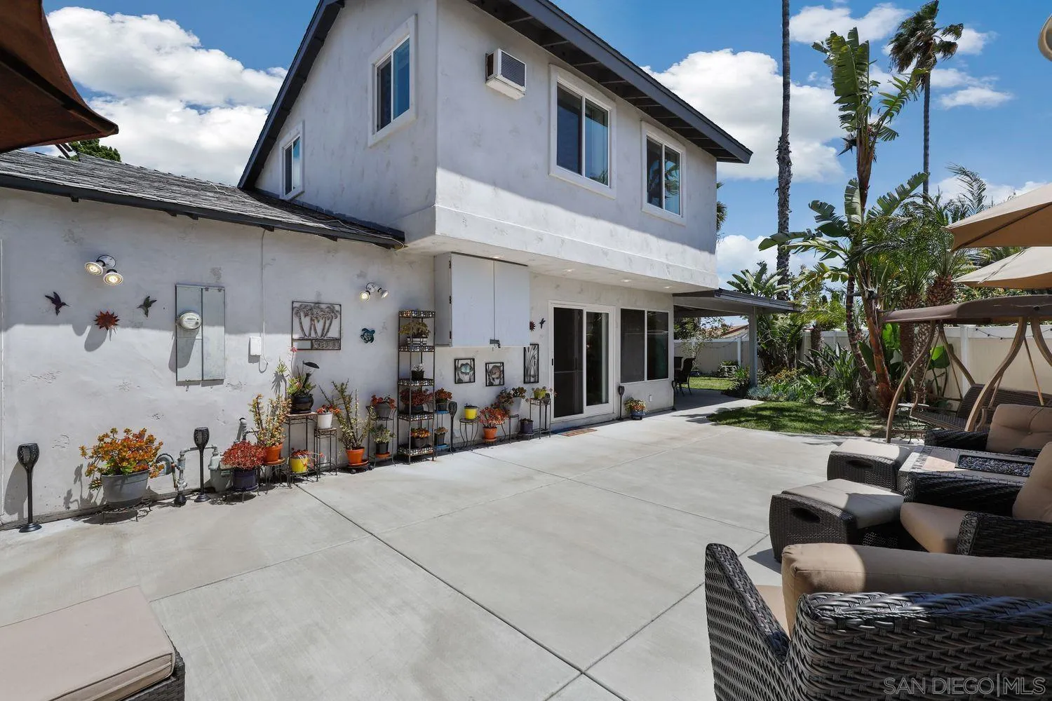 8531 Menkar Road San Diego, CA 92126 - Photo 27 of 37 a view of living room filled with furniture and flowers