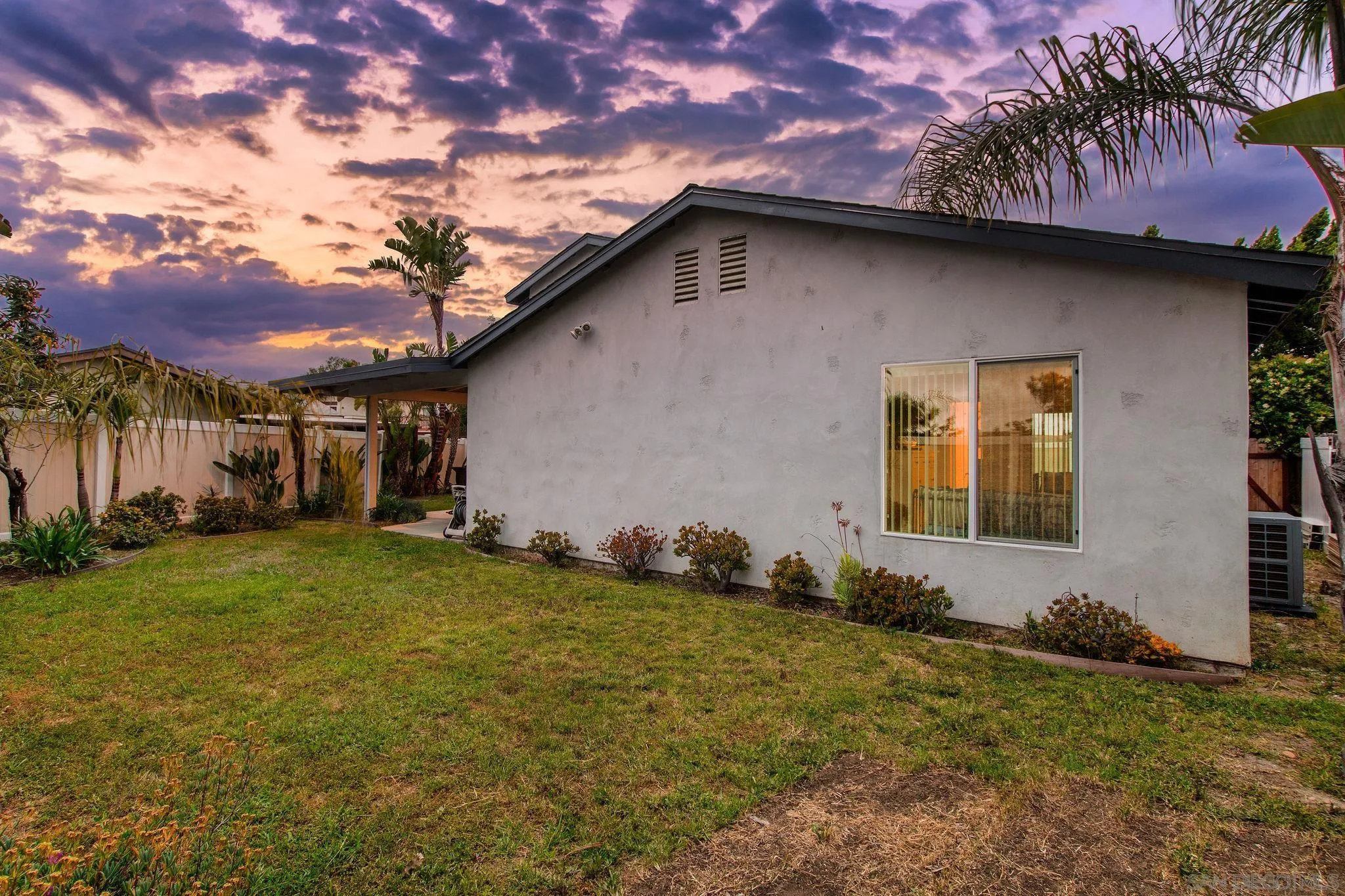 8531 Menkar Road San Diego, CA 92126 - Photo 32 of 37 a backyard of a house with lots of green space