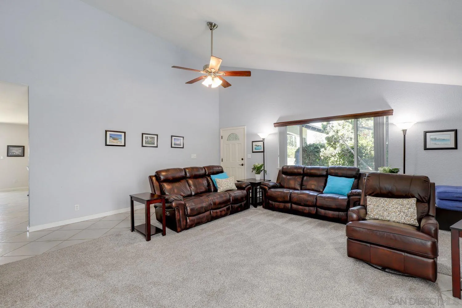 8531 Menkar Road San Diego, CA 92126 - Photo 4 of 37 a living room with furniture a couch and a chandelier