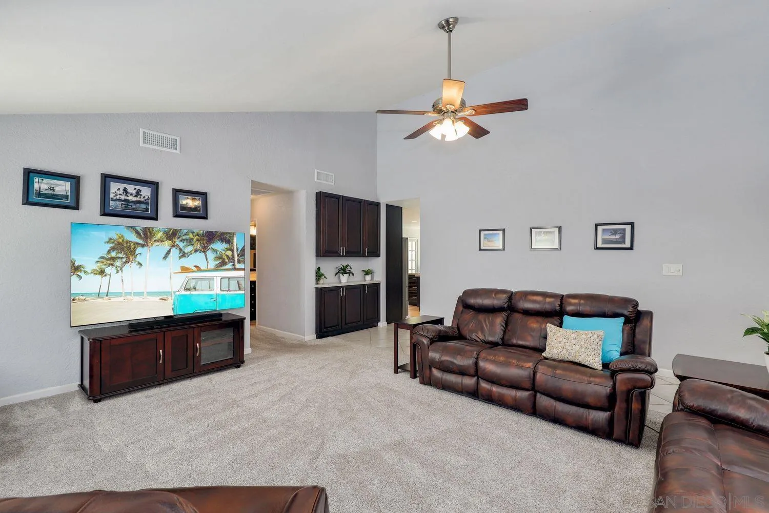 8531 Menkar Road San Diego, CA 92126 - Photo 5 of 37 a living room with furniture and a flat screen tv