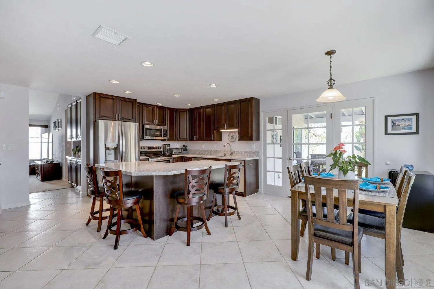 8531 Menkar Road San Diego, CA 92126 - Photo 6 of 37 a view of a dining room with furniture
