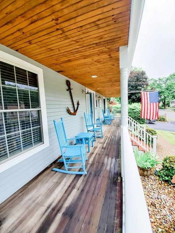 53 Batchelder Road Reading, MA 01867 - Photo 4 of 42 a view of a chair and tables in the balcony