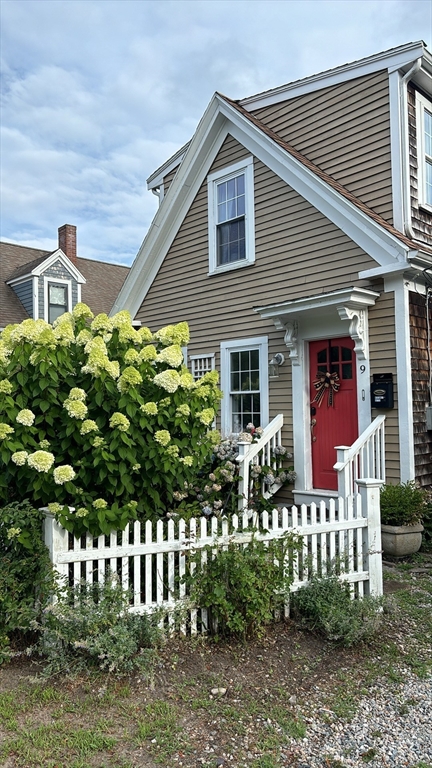 9 Maple Street Kingston, MA 02364 - Photo 1 of 31 a front view of a house with a garden
