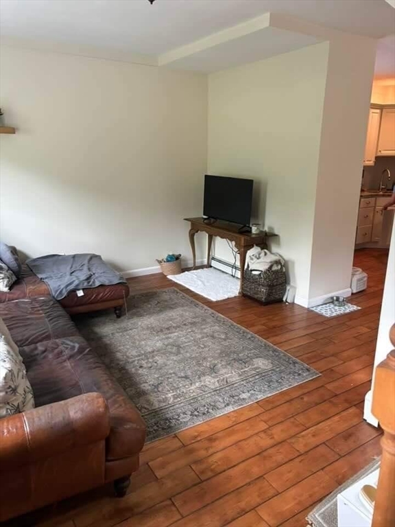 9 Maple Street Kingston, MA 02364 - Photo 7 of 31 a bedroom with a bed and a television