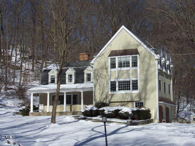 58 Branch Brook Road Wilton, CT 06897 - Photo 1 of 1 a front view of a house with a yard