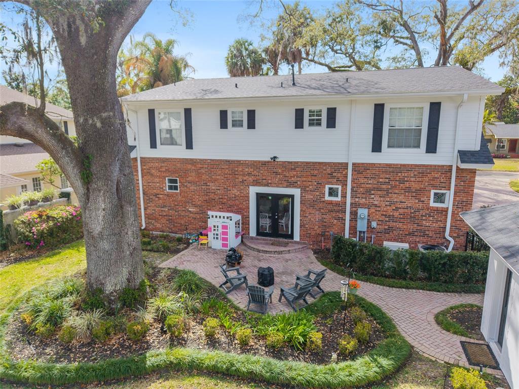 1107 Southeast 9th Avenue Ocala, FL 34471 - Photo 19 of 25 a front view of a house with garden