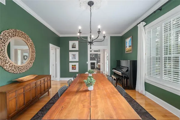 a bed room with a bed mirror and a window