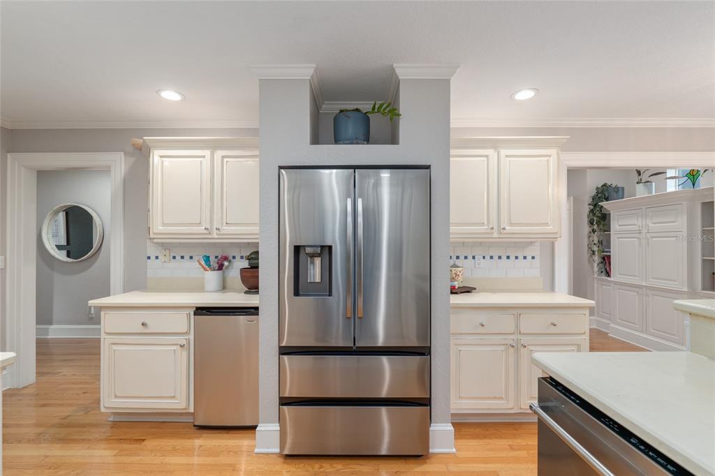 1107 Southeast 9th Avenue Ocala, FL 34471 - Photo 8 of 25 a kitchen with a refrigerator and a sink