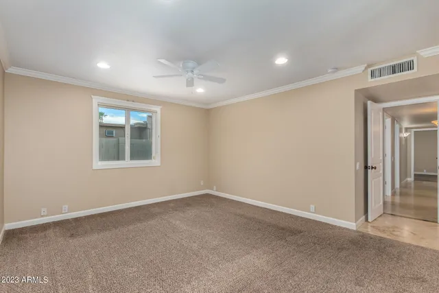 a bathroom with a granite countertop sink a toilet and a mirror