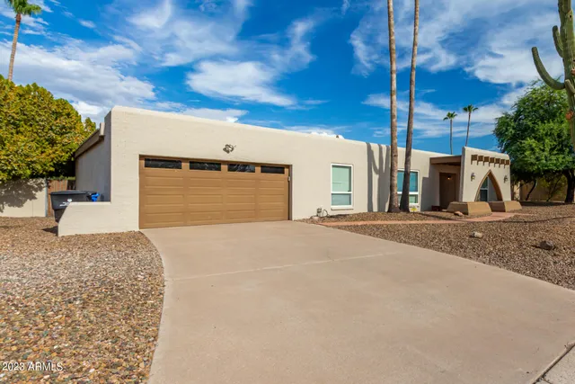 a view of backyard of a house