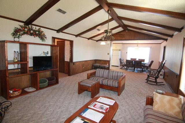 771 U.S. Highway 62 Ralls, TX 79357 - Photo 5 of 10 a living room with furniture and a flat screen tv
